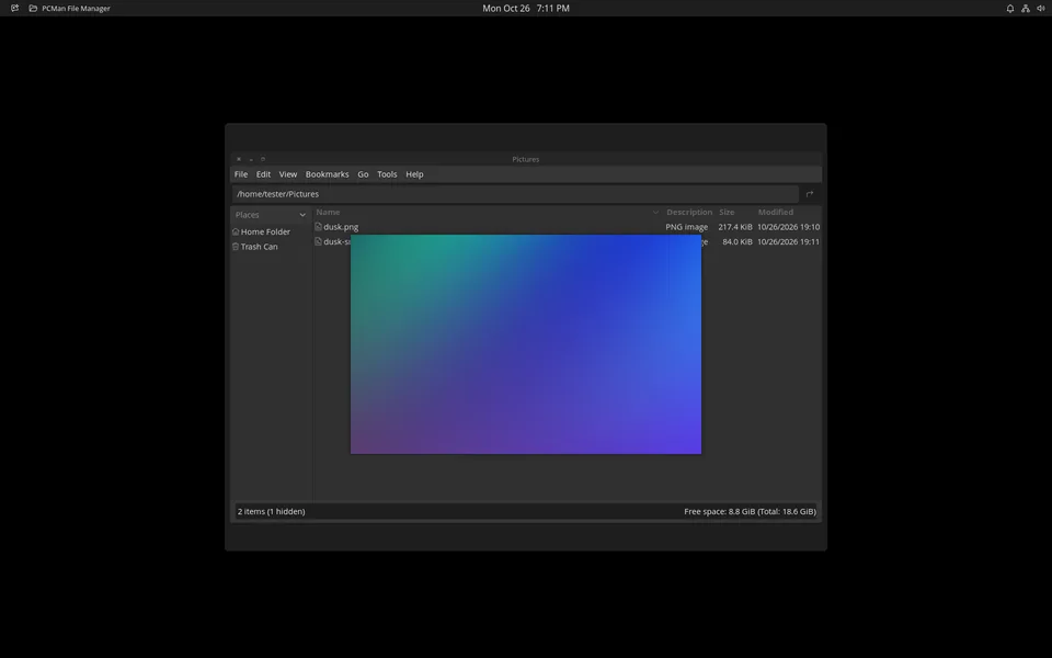 PCManFM showing a Pictures folder, with a preview of a blue and purple gradient image floating over the file list.