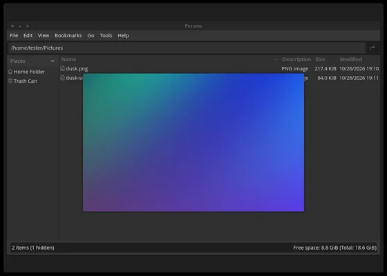 PCManFM showing a Pictures folder, with a Space-bar preview of a blue and purple gradient image floating over the file list.